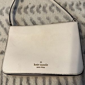 Kate spade white cross body small bag . Worn .